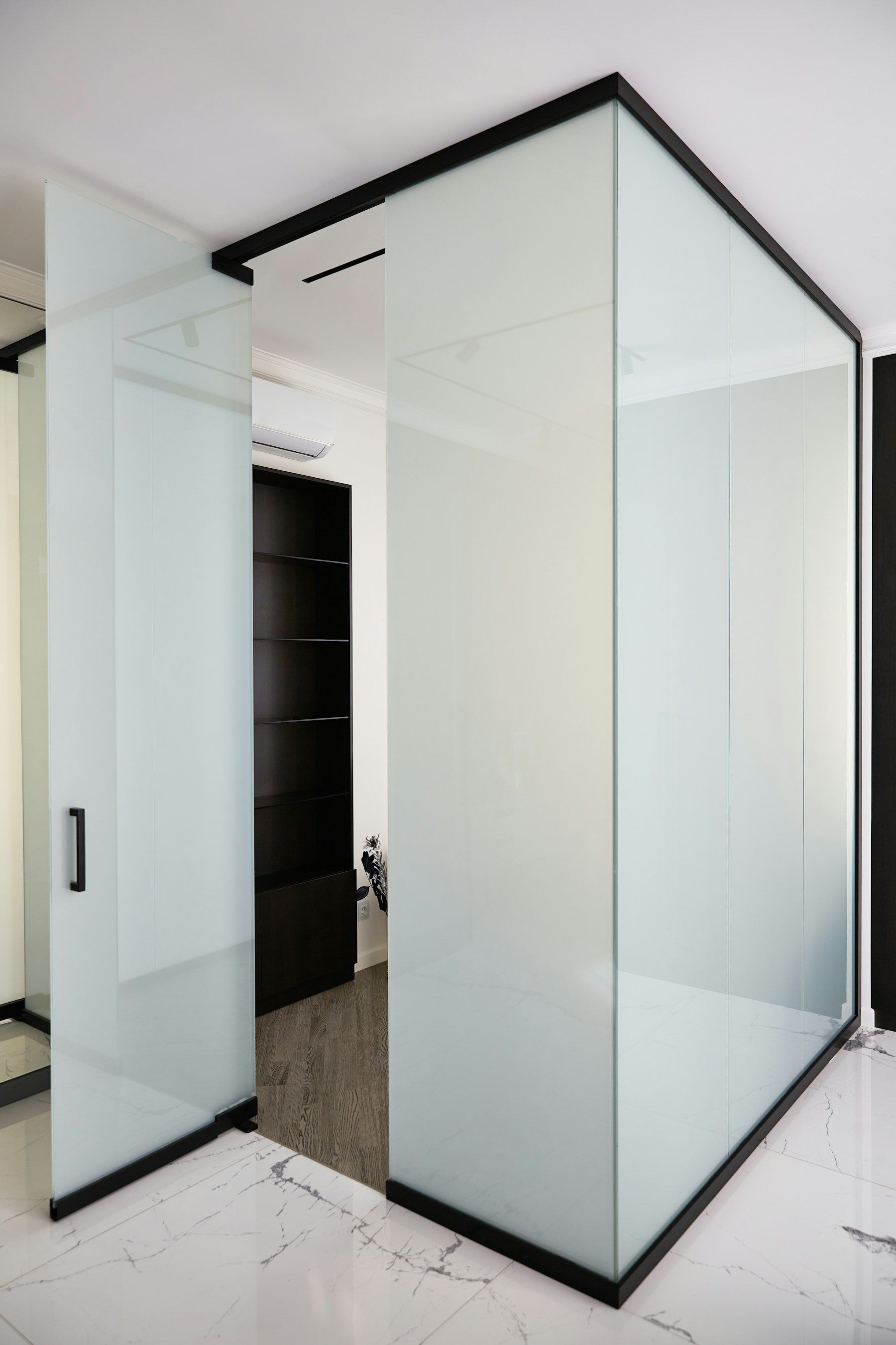 Frosted glass privacy partition with a black frame