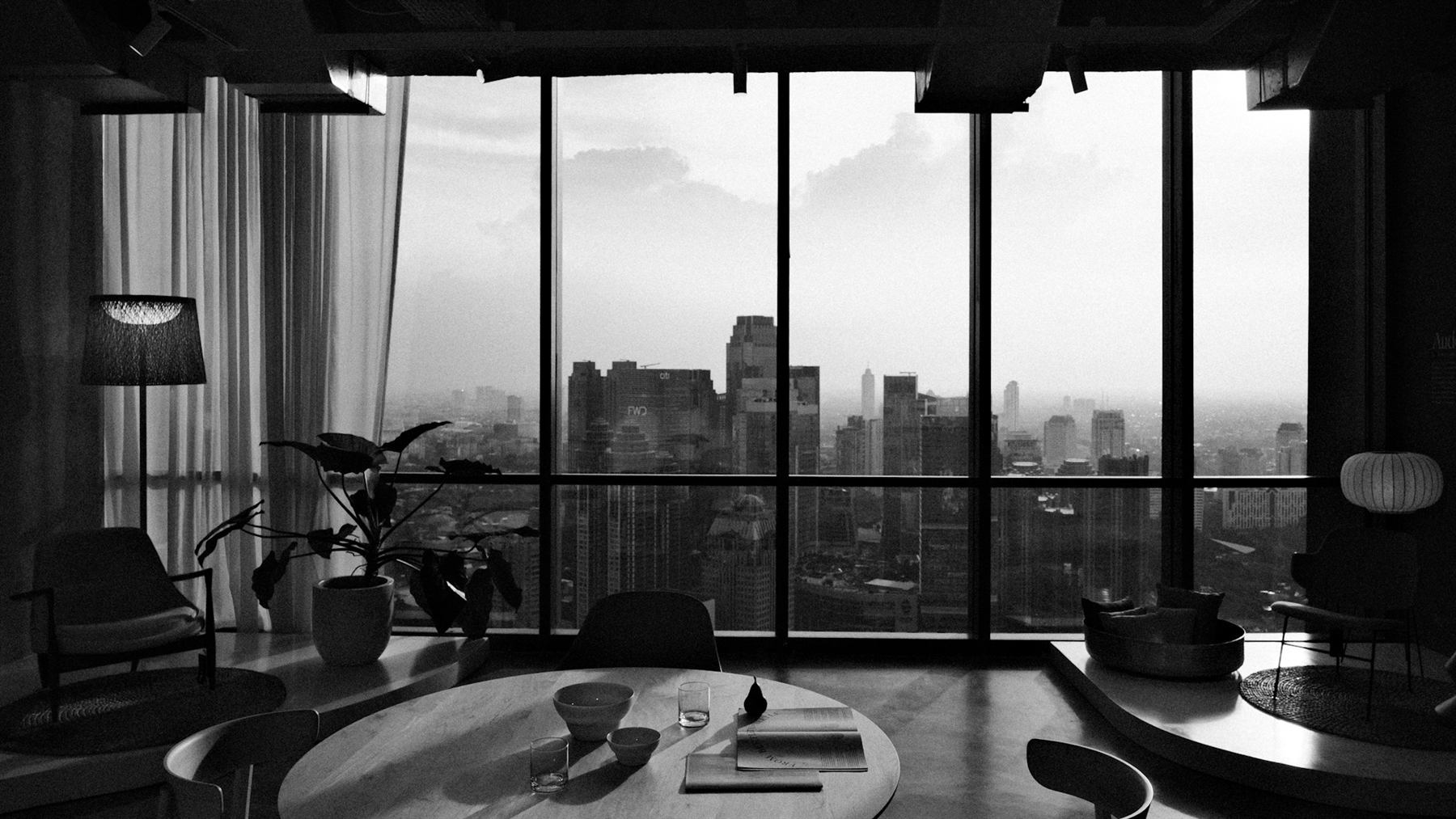 Penthouse living room with floor-to-ceiling city views